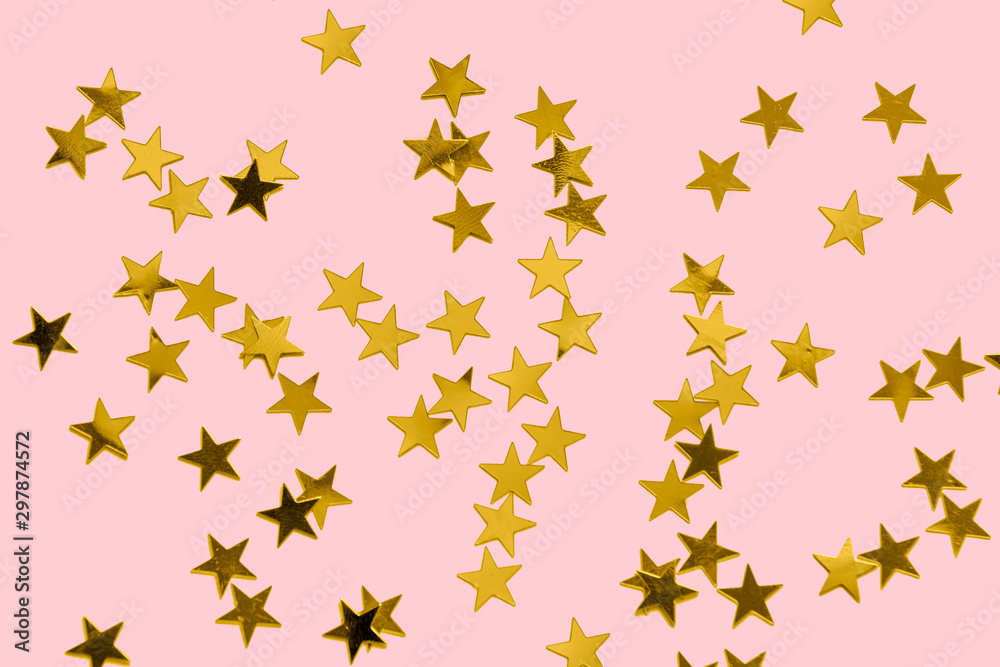 Gold confetti on a pastel pink background Christmas backdrop