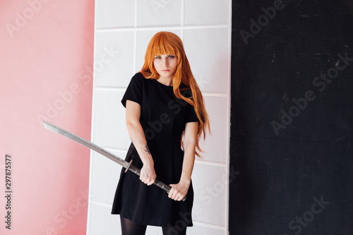 Portrait of a beautiful girl with a Japanese sword cosplayer anime Japan photo