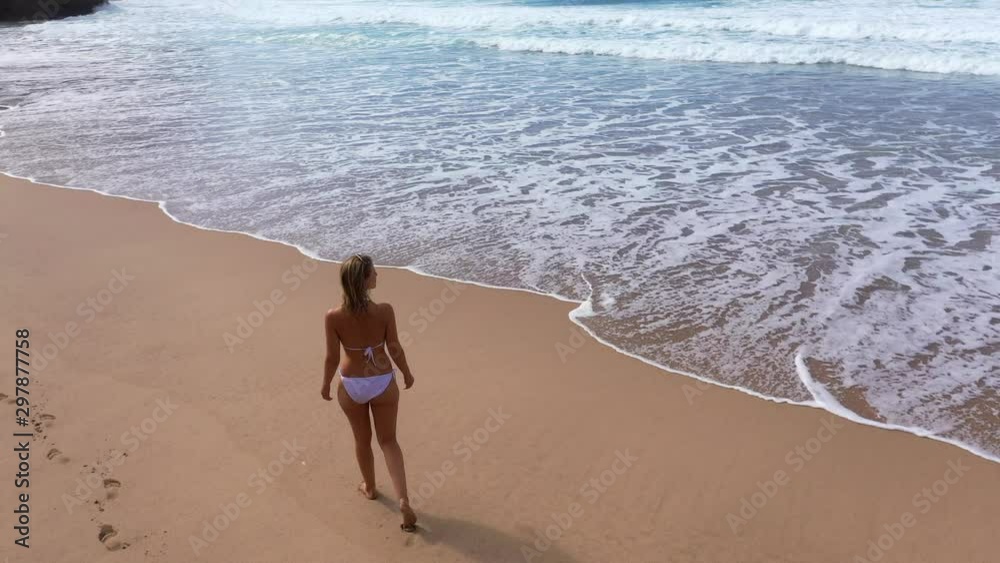 Relaxing walk along the beach on summer holiday - aerial drone footage Relaxing walk along the beach on summer holiday - aerial drone footage