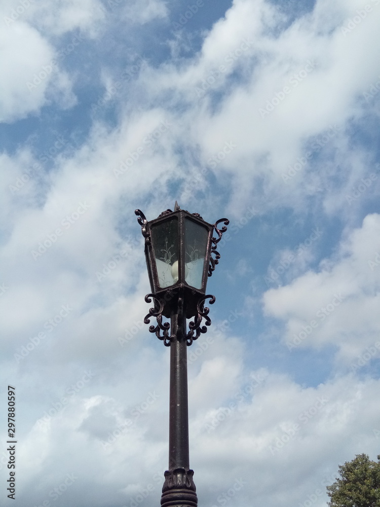 street lamp in front of blue sky