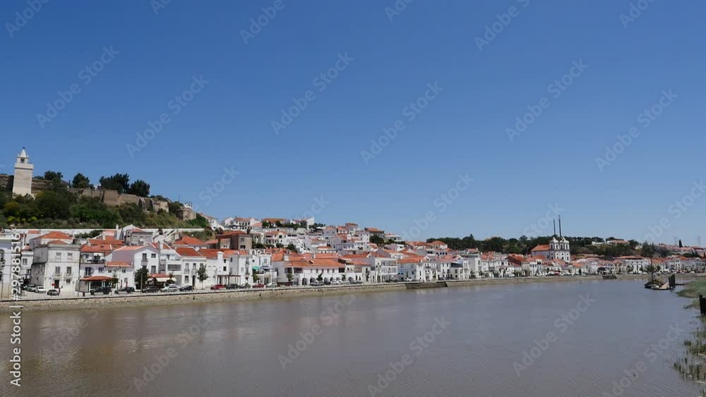 Panoramic view of a white town in Portugal by the riverside. Panoramic view of a white town in Portugal by the riverside.