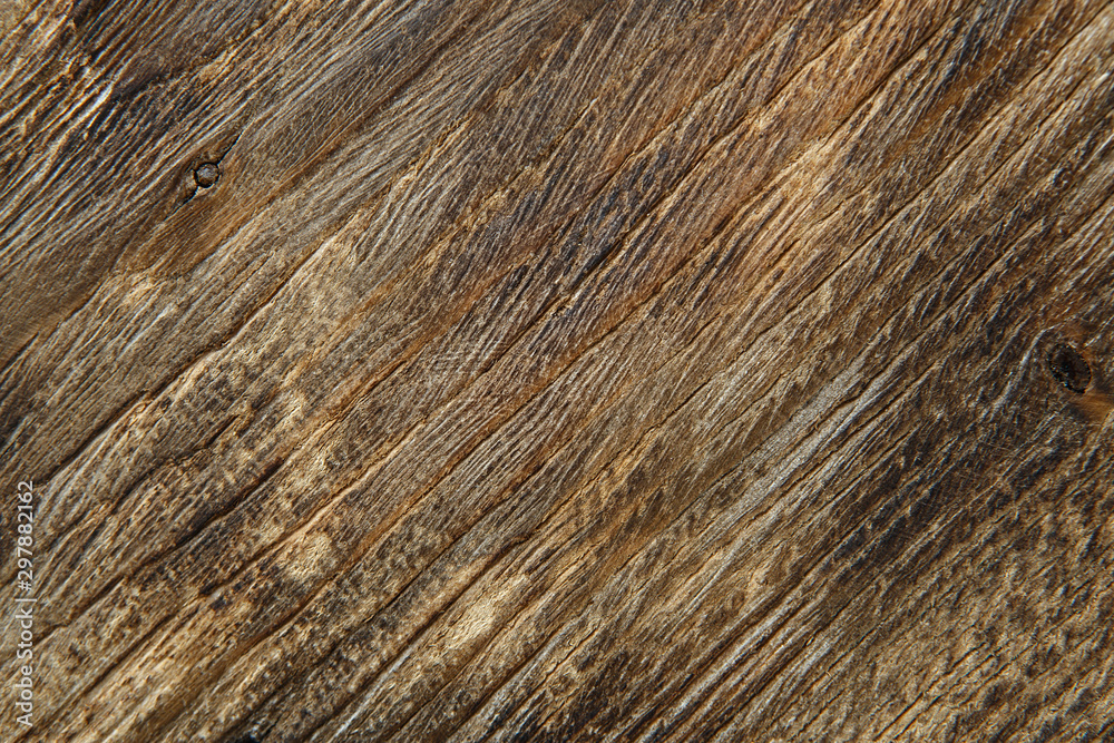 Wooden background texture. Brown scratched wooden cutting board. Wooden background texture. Brown scratched wooden cutting board.