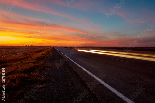 sunset road on a background of colorful sky © EvgenyPyatkov