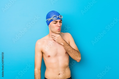 Young swimmer man suffers pain in throat due a virus or infection.