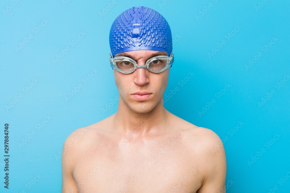 Close up of a teenager caucasian swimmer man