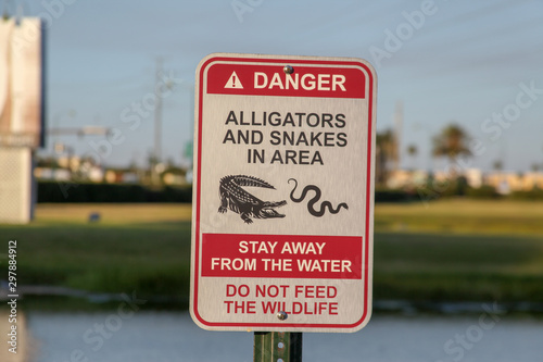 Orlando, USA, October 29, 2019: Warning Sign: Danger of Snakes and Alligators, Orlando, a complex of theme parks, recreation and attractions, eating areas, is the second largest park in the country.