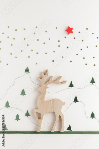 Christmas composition. Reindeer fir star top view background with copy space for your text. Flat lay.