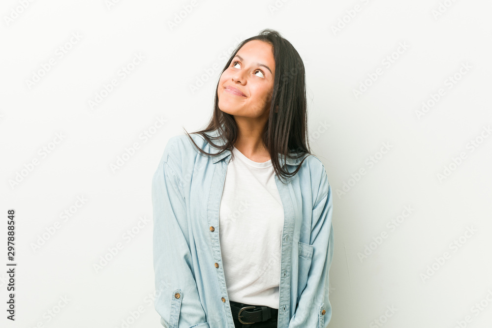 Young hispanic woman dreaming of achieving goals and purposes Young hispanic woman dreaming of achieving goals and purposes