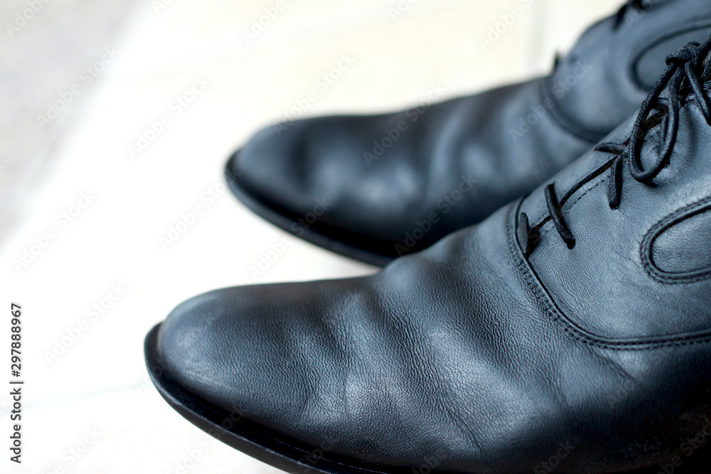 A pair of black leather shoes, Close-up, Selective and soft focus.