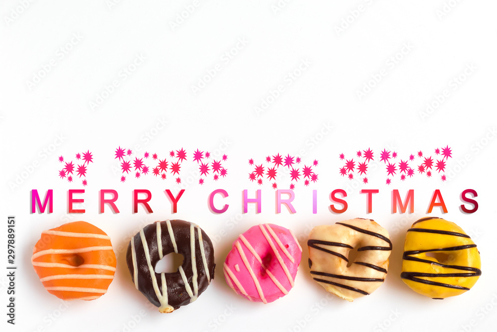 Donuts on white background wih christmas text, Celebration concept. Donuts on white background wih christmas text, Celebration concept.