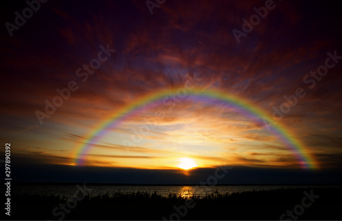 Dramatic rainbow captured during sunset landscape background
