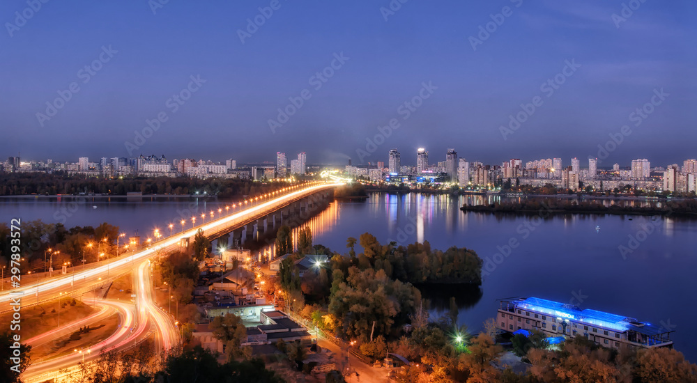 KYIV, UKRAINE – 14 OCTOBER 2019:The night landscape of Paton bridge and left bank of Kyiv