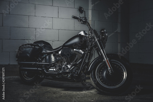 Quadro su tela Amazing brand new motorbike is standing on the dark underground parking