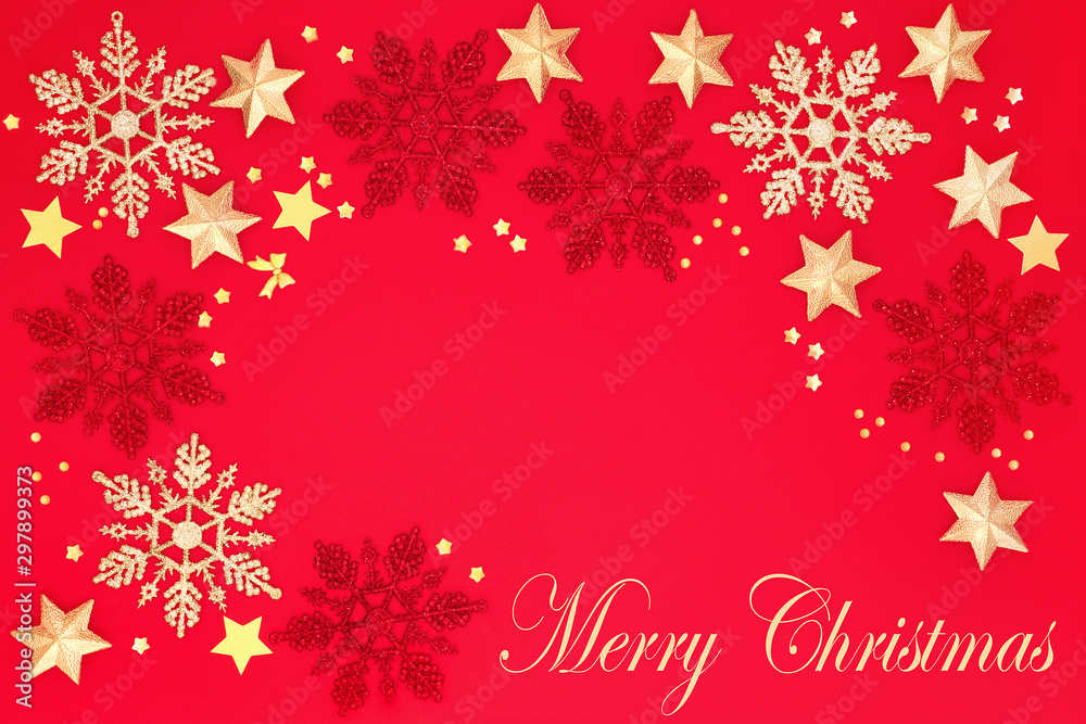 Merry Christmas background border with snowflake and star bauble decorations on red background with copy space. Traditional Christmas card concept for the holiday season. Merry Christmas background border with snowflake and star bauble decorations on red background with copy space. Traditional Christmas card concept for the holiday season.
