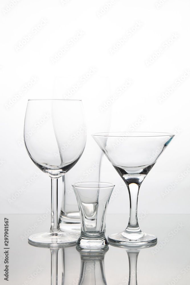 glasses for martini, red wine and vodka on a white background glasses for martini, red wine and vodka on a white background