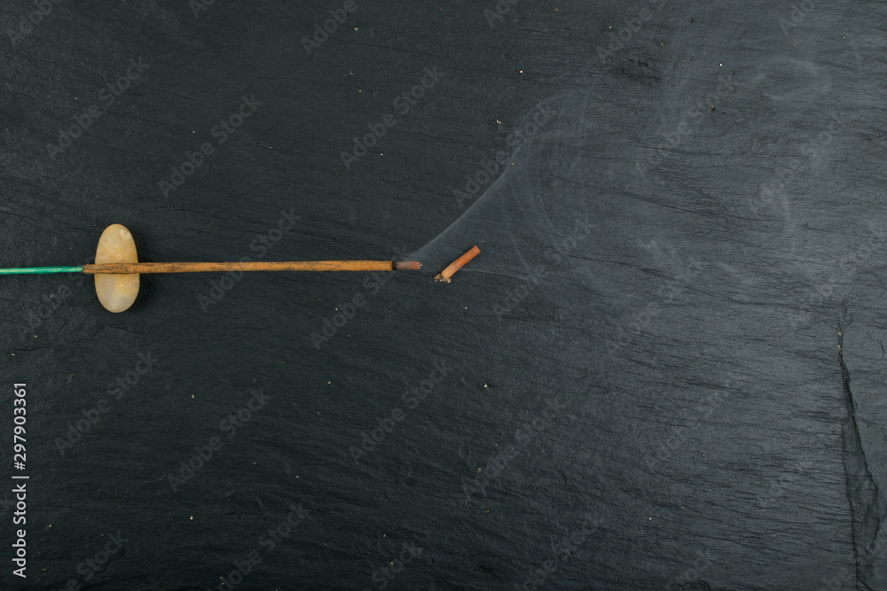Burning incense aroma sticks with smoke on black background Burning incense aroma sticks with smoke on black background