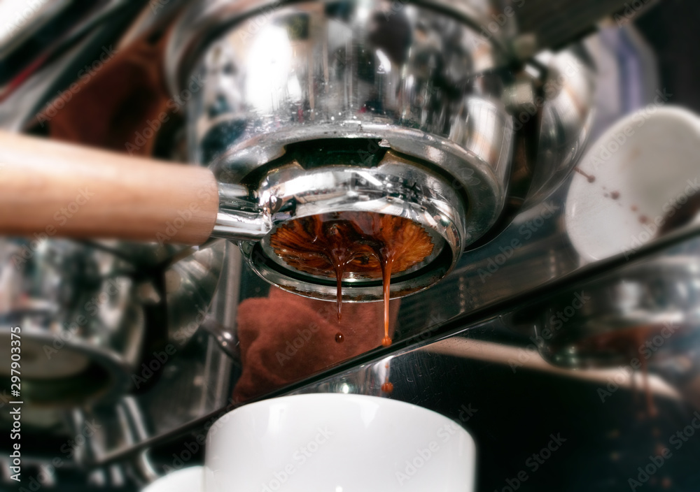 Making espresso coffee in coffeeshop or cafe closeup Making espresso coffee in coffeeshop or cafe closeup