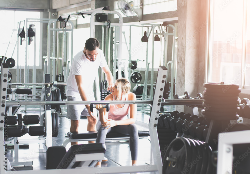 woman working out in sport fitness center woman working out in sport fitness center