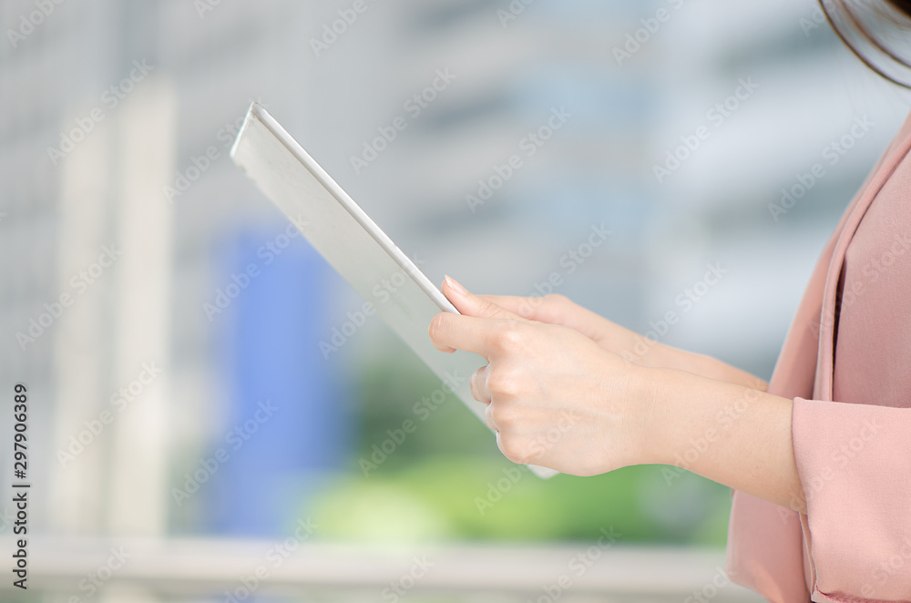 young asian woman watching and touch her tablet doing shopping online young asian woman watching and touch her tablet doing shopping online