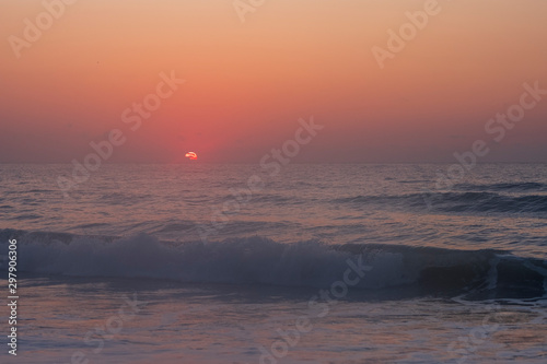 Foggy morning over ocean at sunrise