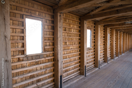 Fototapeta Naklejka Na Ścianę i Meble -  Raw vintage wooden wall with isolated window