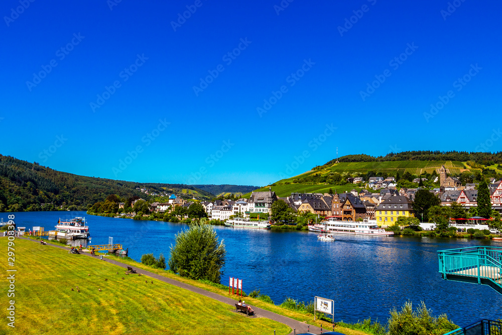 View of the Middle Moselle River with cruise ships and Traben - part of the beautiful town of Traben-Trarbach, Germany