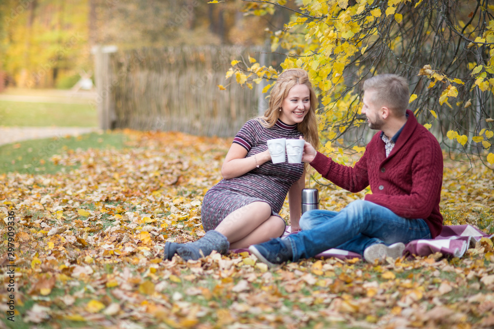 A portrait of young married couple expecting a baby