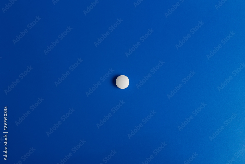 Slide of white tablets on a light table. Slide of white tablets on a light table.