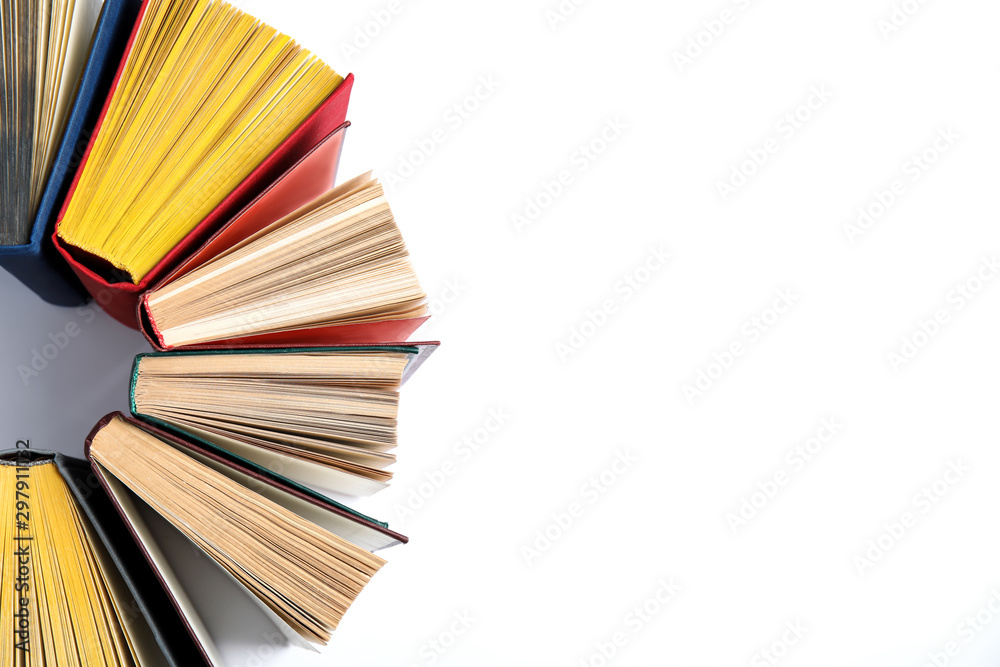 Hardcover books on white background, flat lay. Space for text Hardcover books on white background, flat lay. Space for text