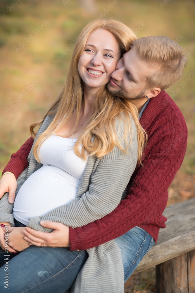 A portrait of young married couple expecting a baby A portrait of young married couple expecting a baby