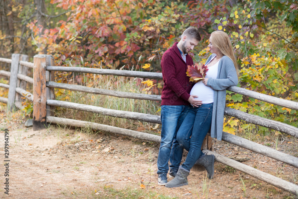 A portrait of young married couple expecting a baby A portrait of young married couple expecting a baby