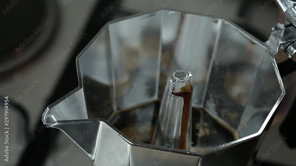 Italian espresso coffee boiling in a moka pot ,closeup in action. Italian espresso coffee boiling in a moka pot ,closeup in action.