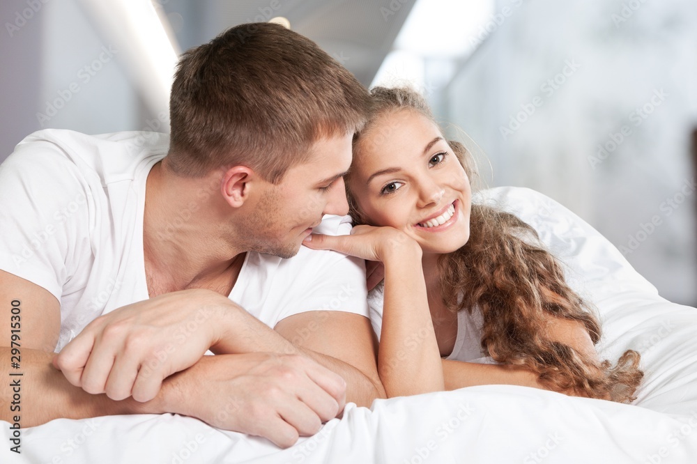 Beautiful sleeping woman in white bed with flares Beautiful sleeping woman in white bed with flares