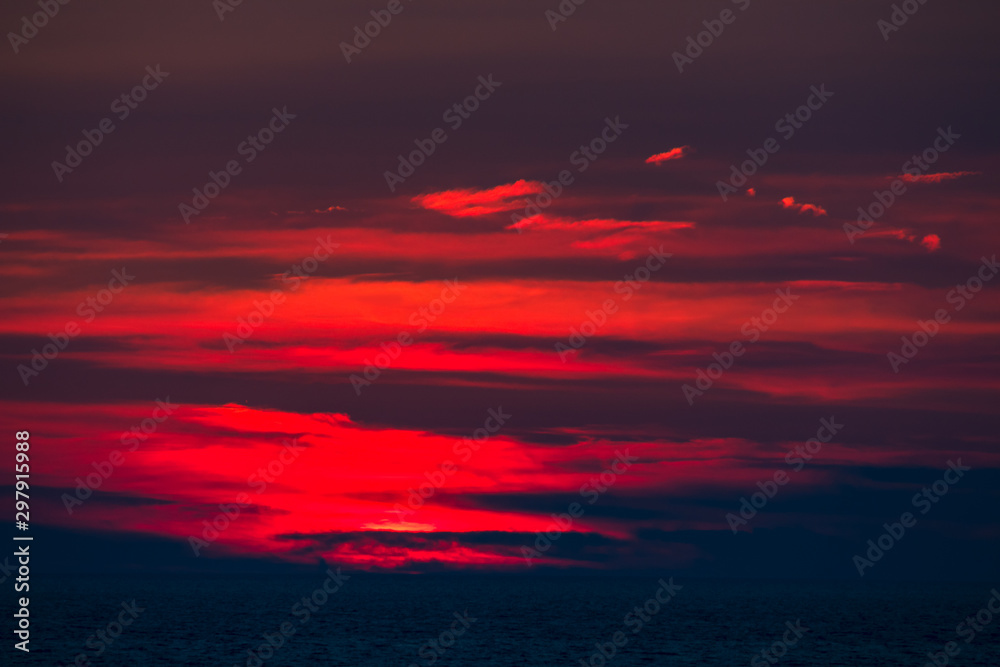 breathtaking red sunset sunrise on the Adriatic Sea in Montenegro.