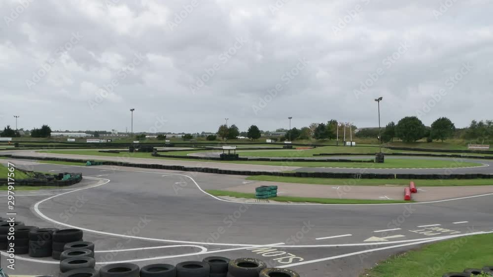 Go karts racing round a kart track