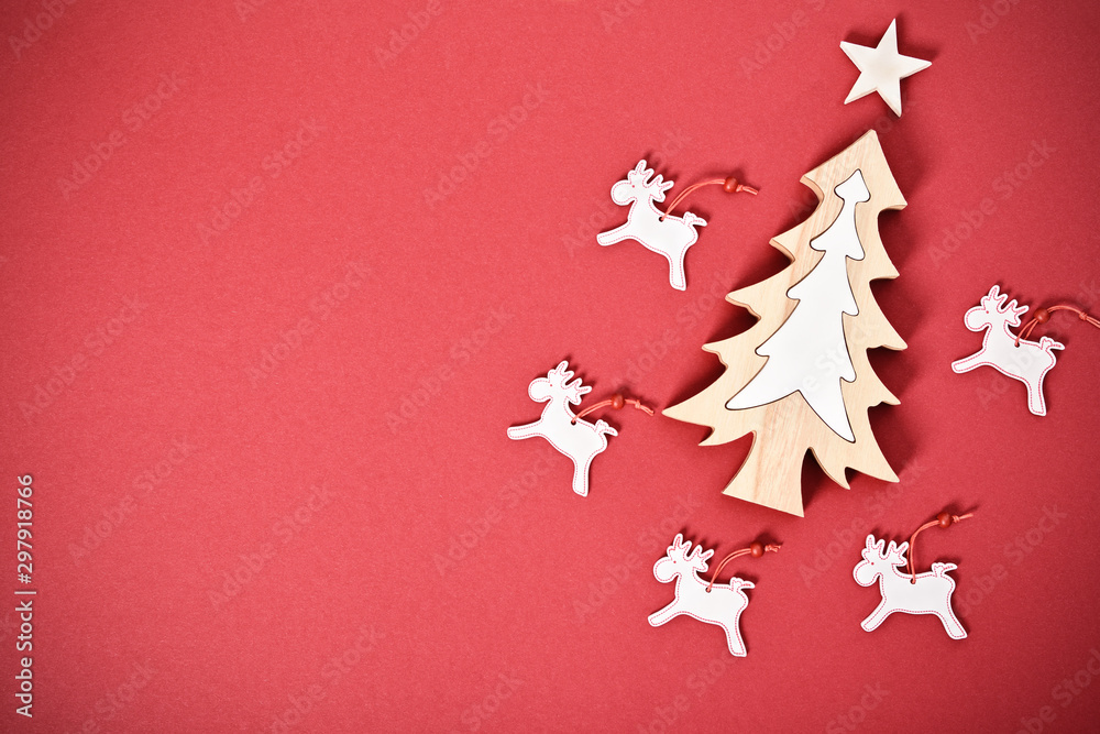 Seasonal greeting card concept with Christmas tree and raindeers