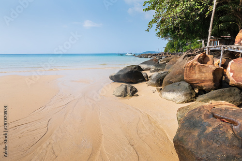 Natural beach on tropical paradise island for summer vacation holidays, stones, sand and turquoise sea water