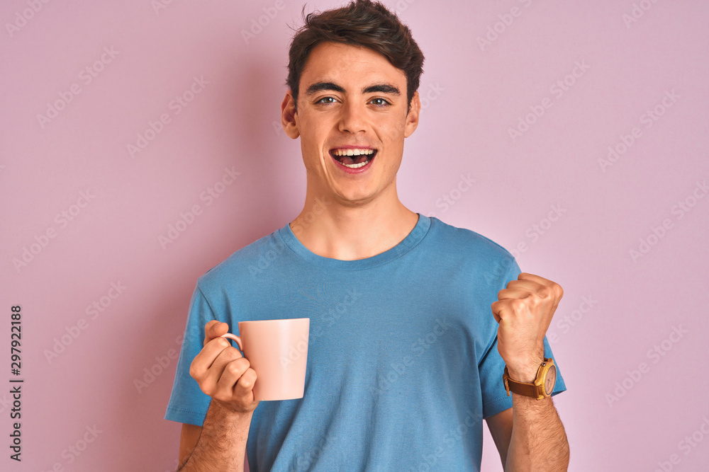 Teenager boy drinking a cup of coffee over isolated pink background screaming proud and celebrating victory and success very excited, cheering emotion Teenager boy drinking a cup of coffee over isolated pink background screaming proud and celebrating victory and success very excited, cheering emotion