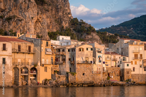 Seafront of Tyrrhenian Sea and Medieval houses of Sicilian coastal medieval city Cefalu in sunset photo