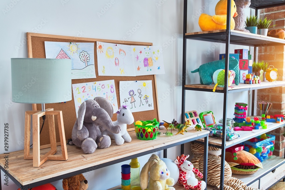 Beautiful games corner with lots of toys and draws at kindergarten Beautiful games corner with lots of toys and draws at kindergarten