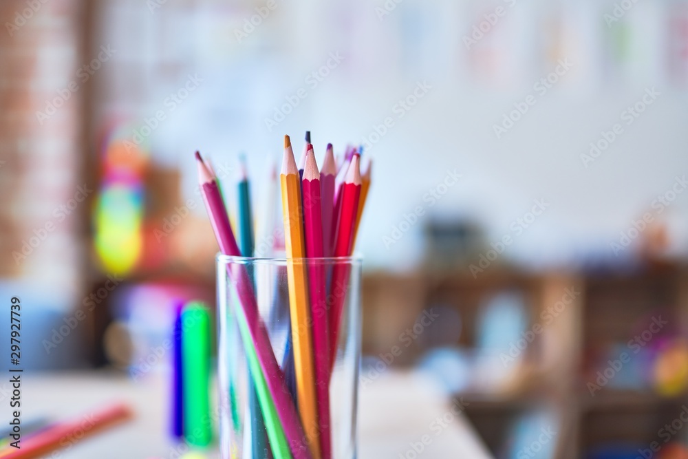 Desk with lots of colored pencils and pen to draw at kindergarten Desk with lots of colored pencils and pen to draw at kindergarten