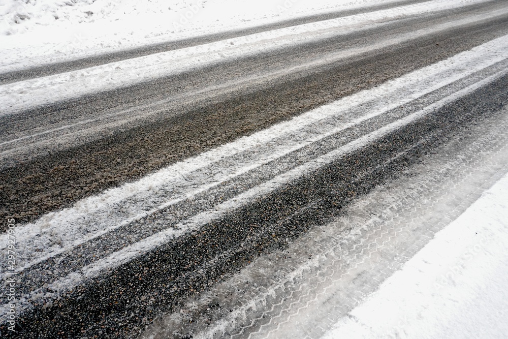 Naklejka premium Beautiful winter landscape with snow-covered trees and road in Latvia.