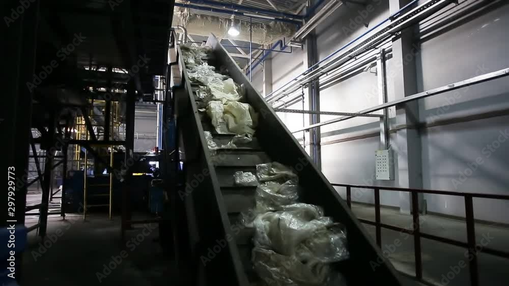 moving conveyor transporter on Modern waste recycling processing plant. Separate and sorting garbage collection. Recycling and storage of waste for further disposal. 