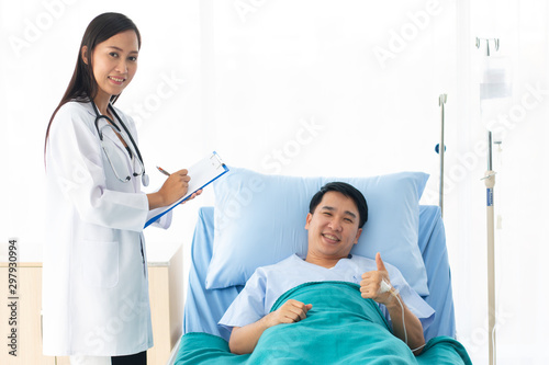 female doctor with happy patient at the hospital.