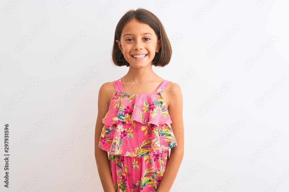Young beautiful child girl wearing pink floral dress standing over isolated white background with a happy and cool smile on face. Lucky person. Young beautiful child girl wearing pink floral dress standing over isolated white background with a happy and cool smile on face. Lucky person.