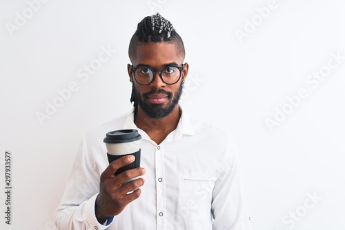 African american businessman with braids drinking coffee over isolated white background with a confident expression on smart face thinking serious