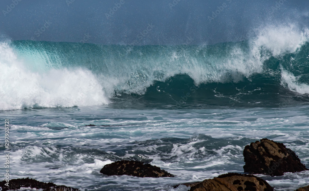 waves crashing on rocks