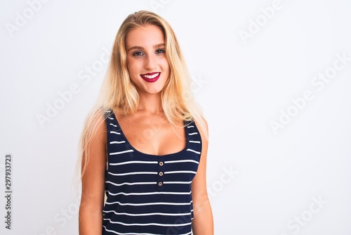 Young beautiful woman wearing casual striped t-shirt standing over isolated white background with a happy and cool smile on face. Lucky person. © Krakenimages.com