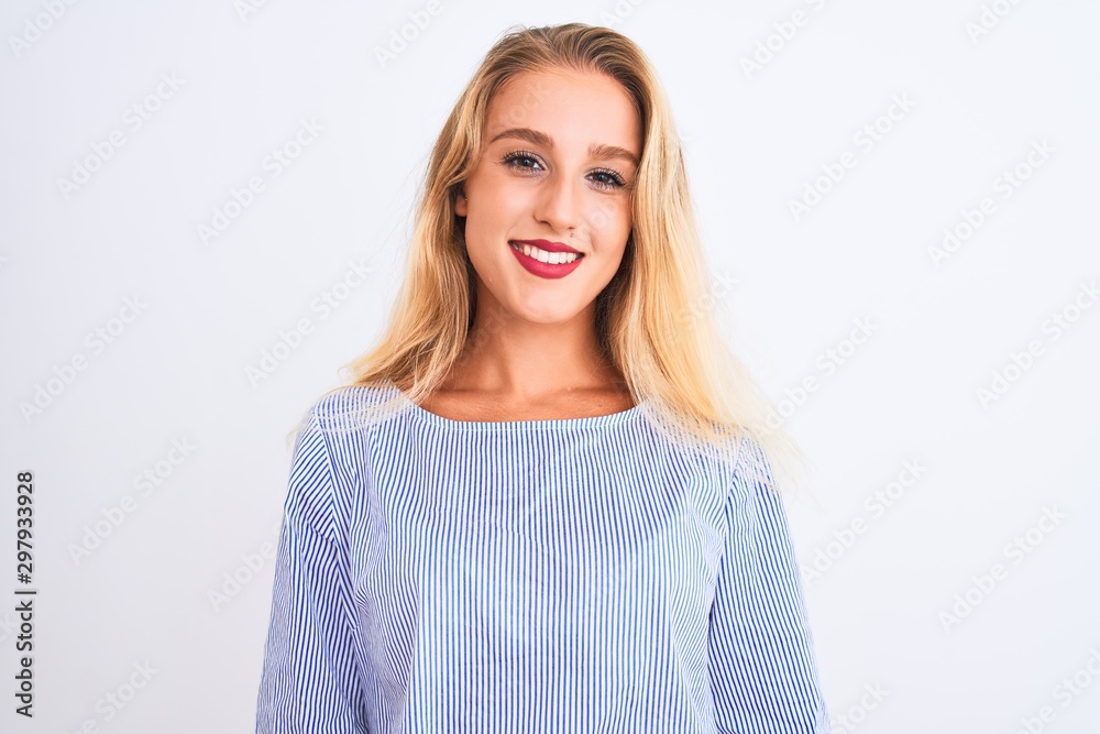 Young beautiful woman wearing elegant blue t-shirt standing over isolated white background with a happy and cool smile on face. Lucky person. Young beautiful woman wearing elegant blue t-shirt standing over isolated white background with a happy and cool smile on face. Lucky person.