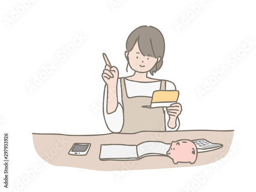 家計簿をつける若い女性